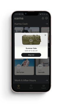 Smartphone showing pop-up summer sale ad for handbag