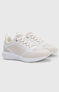 Pair of beige and white running shoes