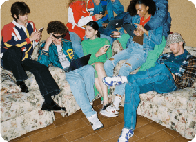 Group of young people using electronic devices