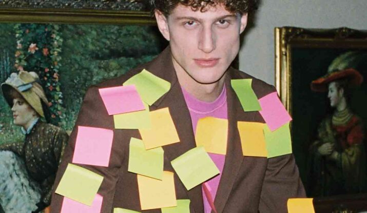 Man wearing suit covered in colorful sticky notes