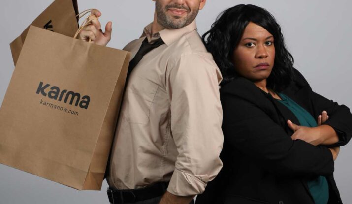 Man with shopping bags and woman standing back-to-back