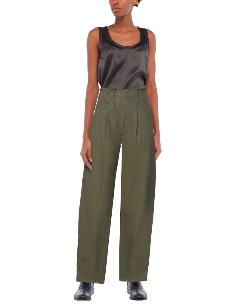 Woman wearing black sleeveless top and olive wide-leg pants