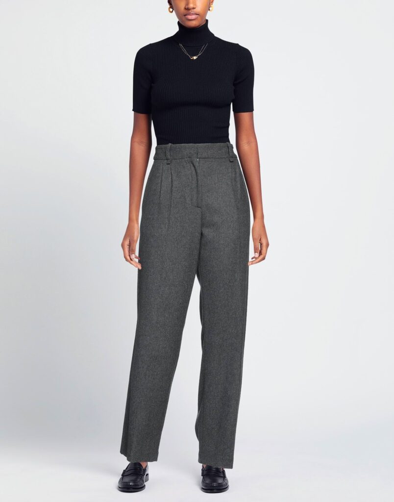 Woman wearing black top and gray wide-leg pants