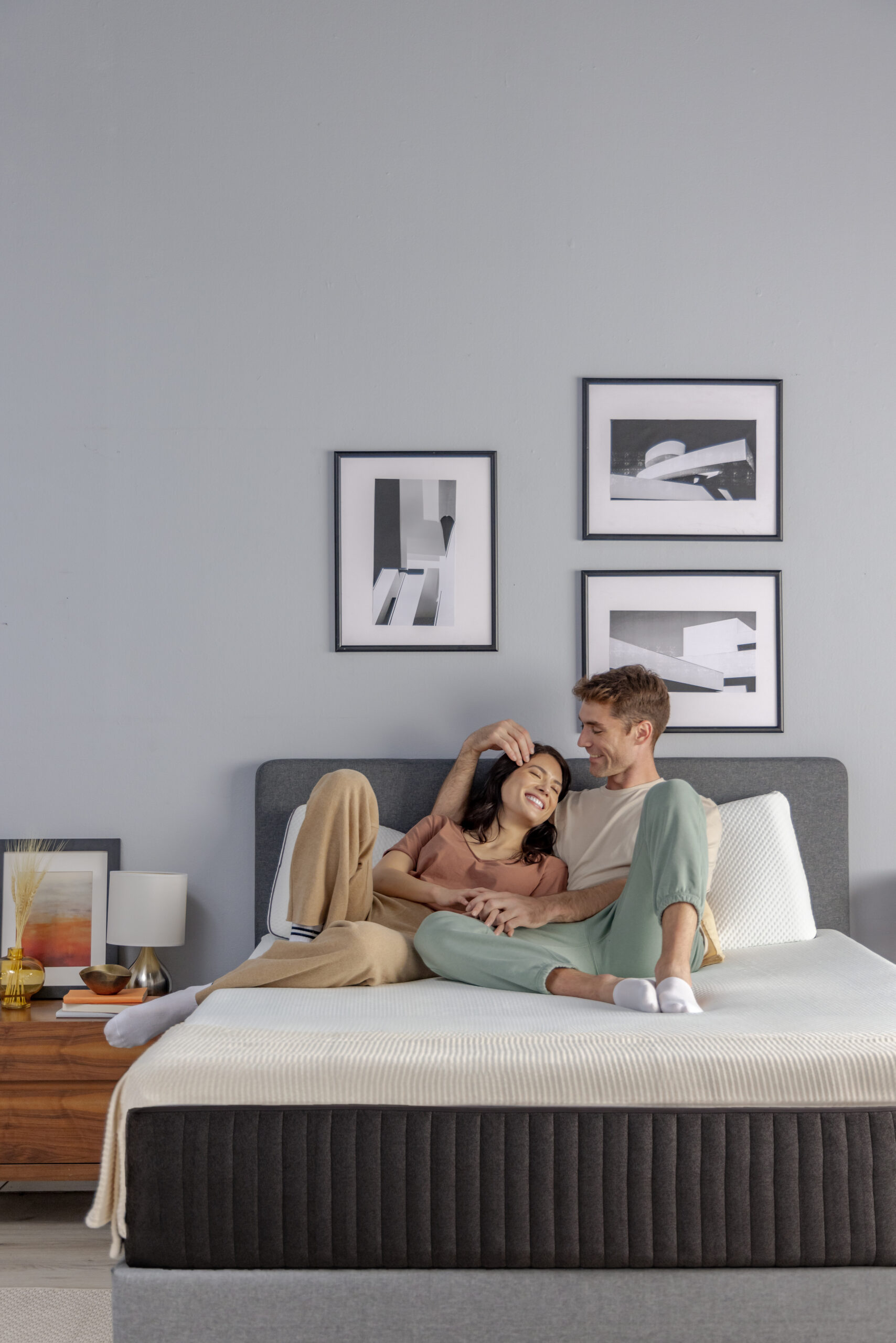 Couple relaxing affectionately together on bed