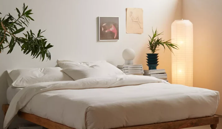 Minimalist bedroom with wooden bed and soft lighting