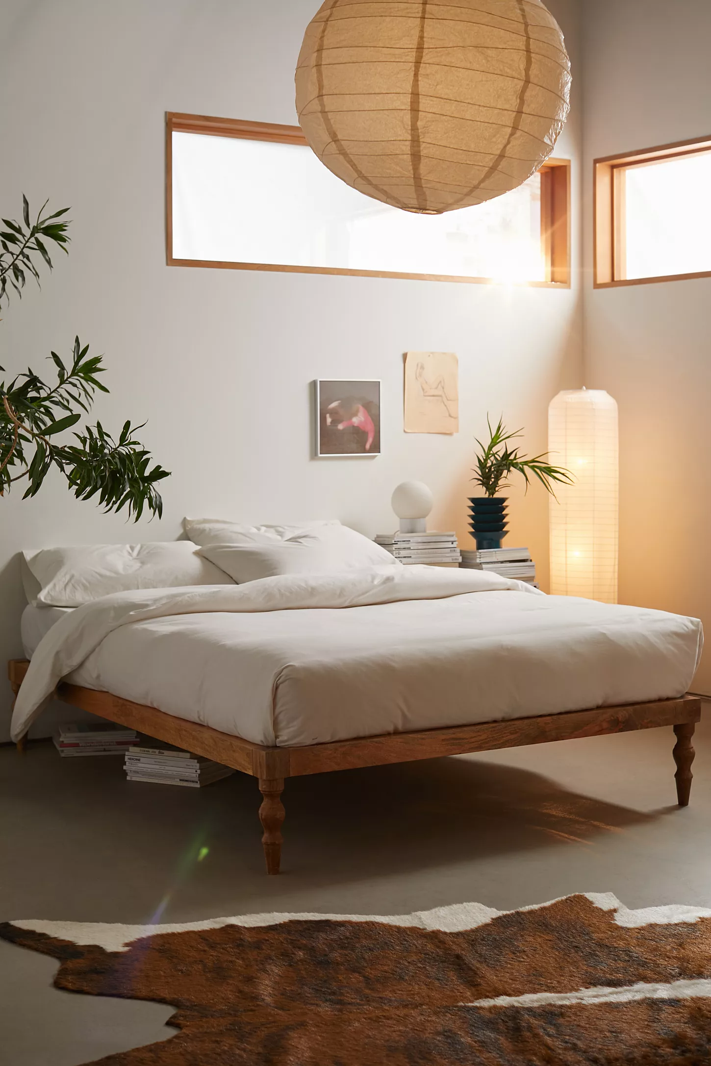 Minimalist bedroom with wooden bed and soft lighting