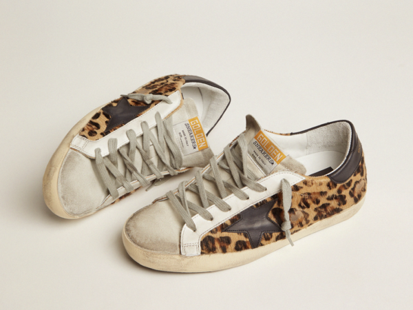 Pair of leopard print and leather sneakers