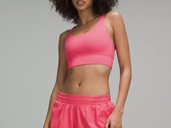 Woman wearing pink sports bra and shorts