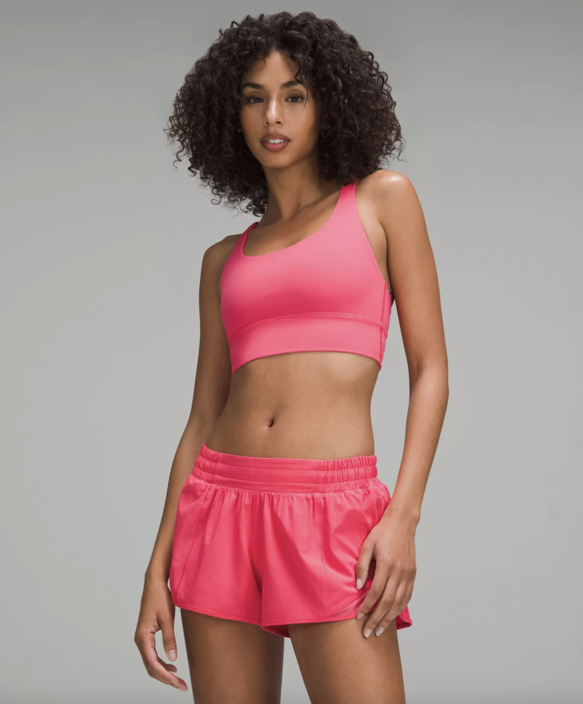 Woman wearing pink sports bra and shorts