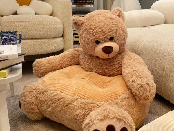 Large plush teddy bear chair in cozy living room