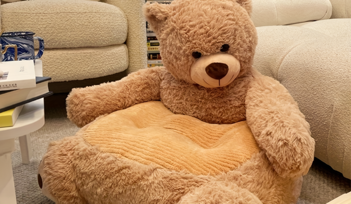 Large plush teddy bear chair in cozy living room