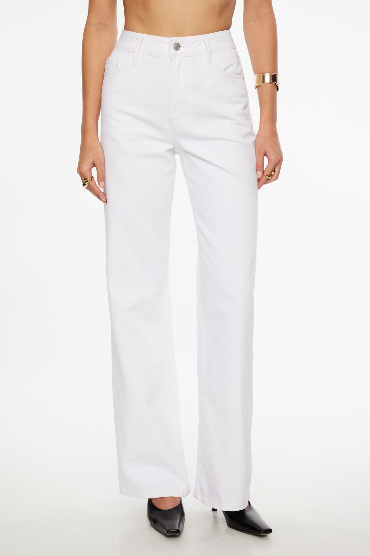 Woman wearing white high-waisted wide-leg jeans