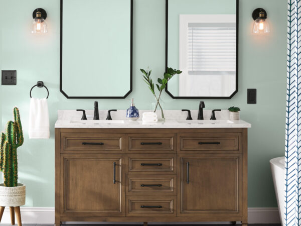 Double sink wooden vanity with mirrors and cactus