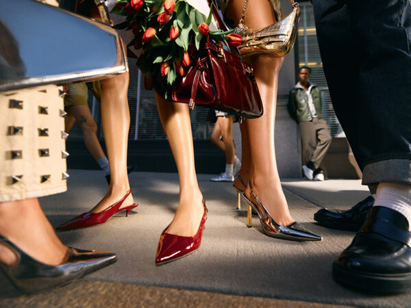 Stylish shoes and handbags on city sidewalk