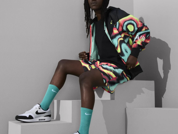 Person wearing colorful outfit and Nike sneakers