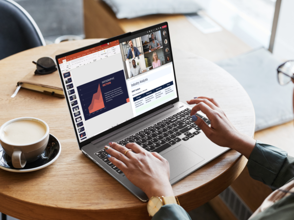 Person working on laptop during virtual business meeting