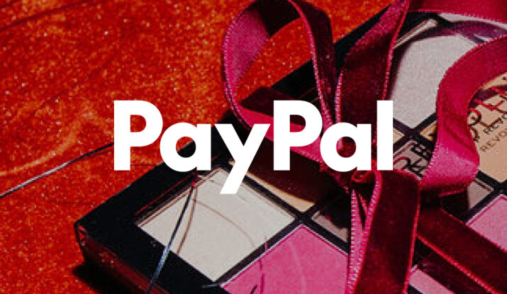 Red ribbon on a gift box with PayPal logo