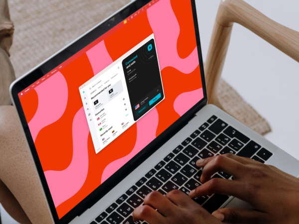 Person typing on laptop with VPN app open