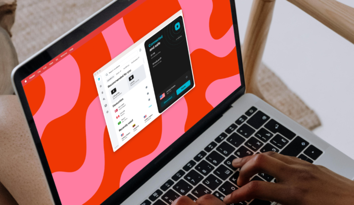Person typing on laptop with VPN app open