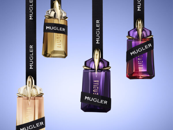 Four hanging Mugler Alien perfume bottles with ribbons