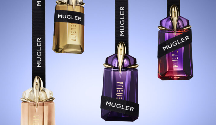 Four hanging Mugler Alien perfume bottles with ribbons