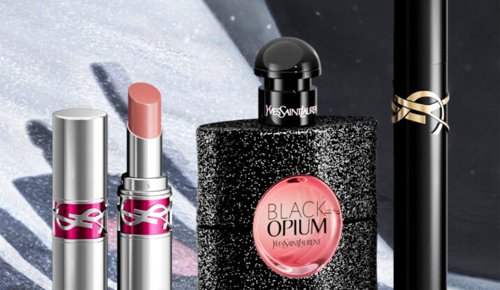 Yves Saint Laurent lipstick, perfume, mascara on snow