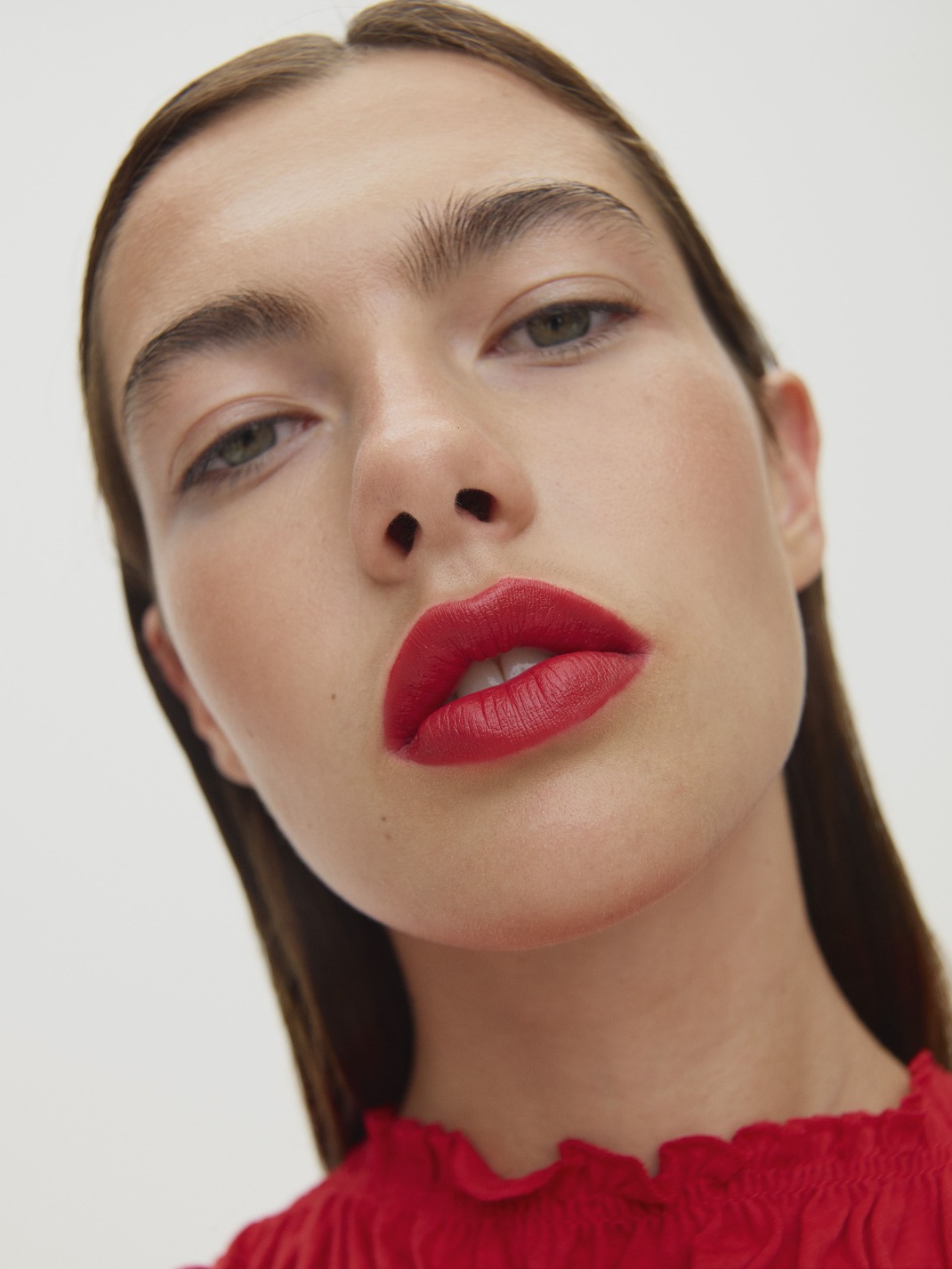 Close-up of woman with red lipstick and top