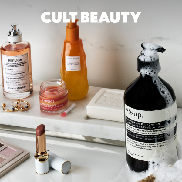 Assorted beauty products on marble shelf with foam
