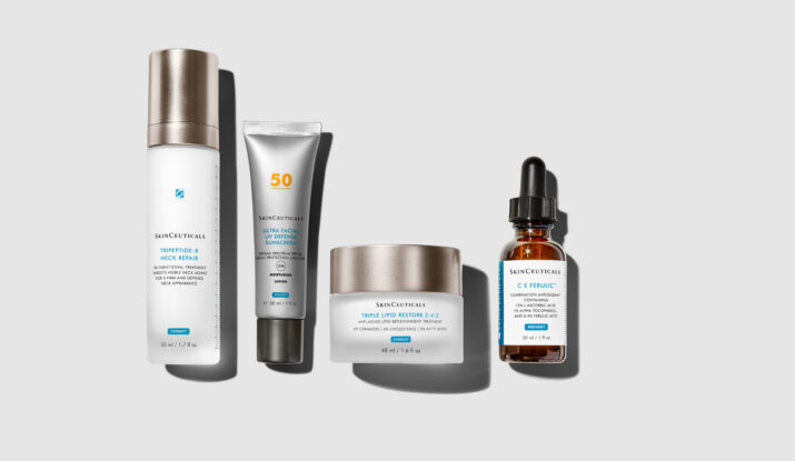 Four SkinCeuticals skincare products on gray background