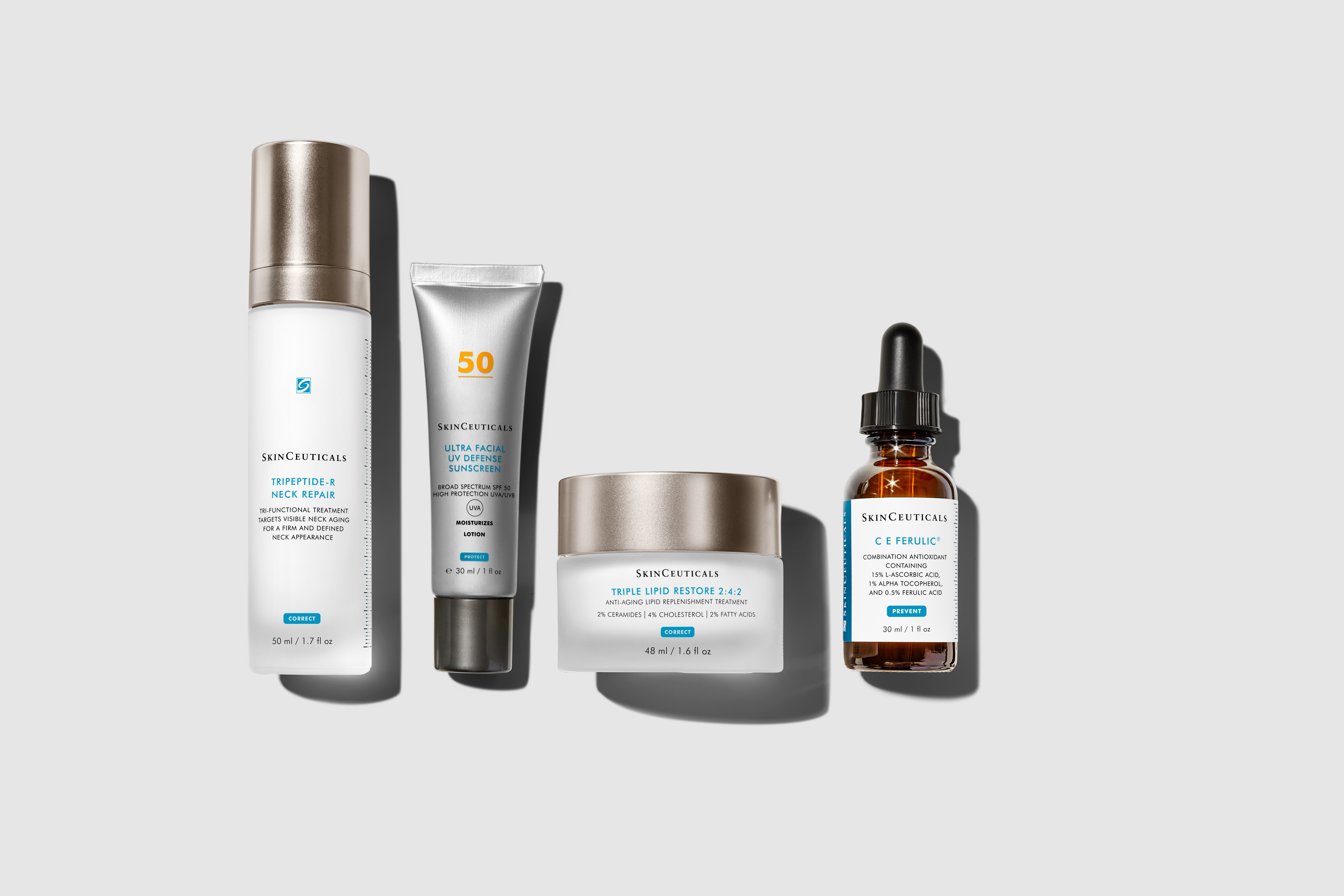 Four SkinCeuticals skincare products on gray background