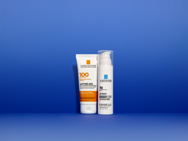 Two La Roche-Posay sunscreens against blue background