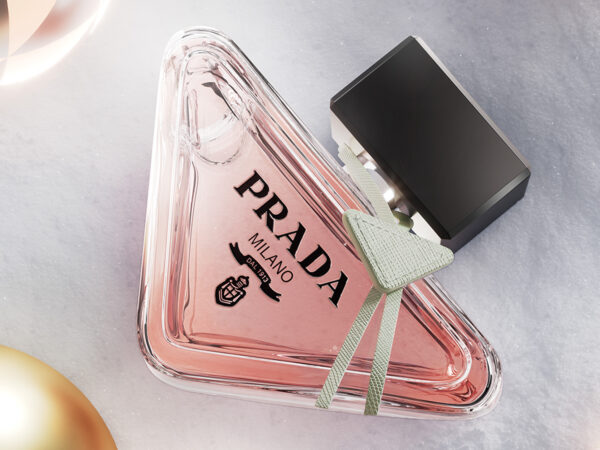 Triangular pink Prada perfume bottle with black cap