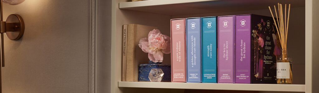 Colorful books and flower decoration on shelf