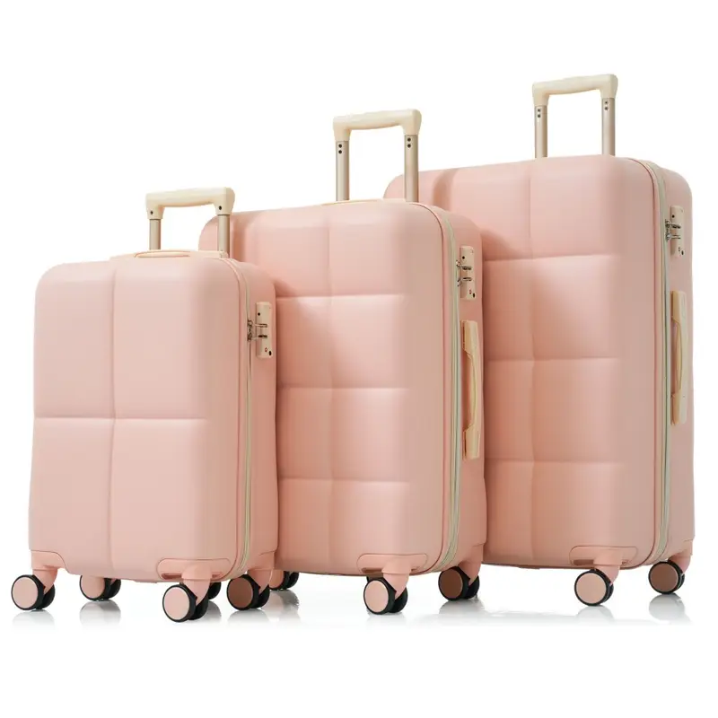 Set of three pink suitcases with wheels and handles