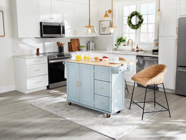 Bright kitchen with blue island, wicker chair