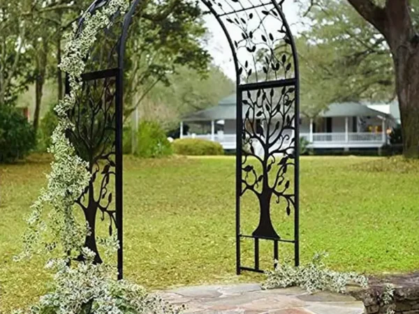 Black metal garden arch with tree design and vines