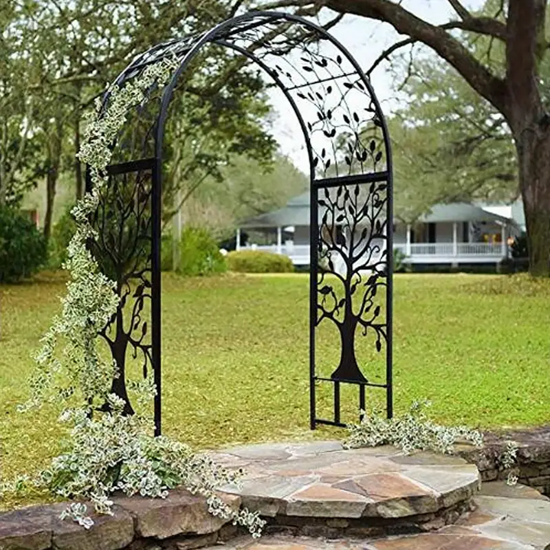 Black metal garden arch with tree design and vines