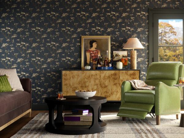 Cozy living room with green recliner and floral wallpaper