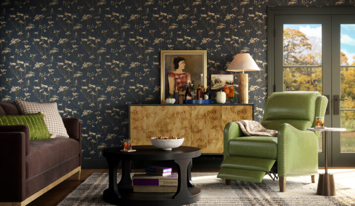 Cozy living room with green recliner and floral wallpaper