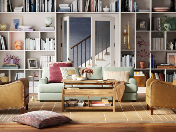 Cozy living room with mint green sofa, brown chairs, and bookshelf