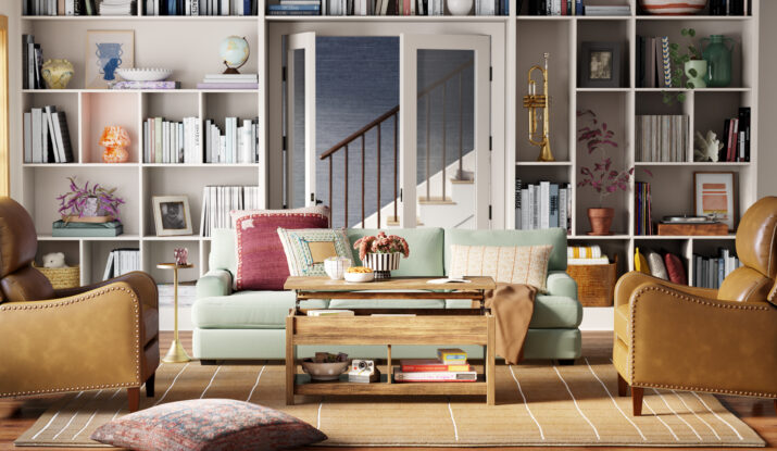 Cozy living room with mint green sofa, brown chairs, and bookshelf