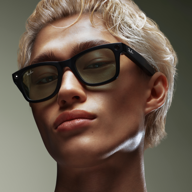 Close-up of person wearing black Ray-Ban sunglasses