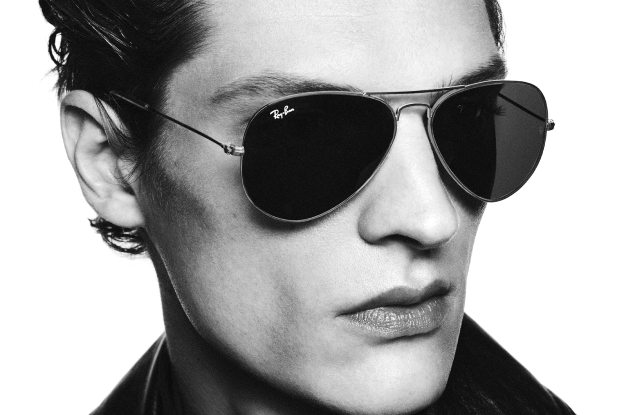 Man wearing Ray-Ban aviator sunglasses and leather jacket