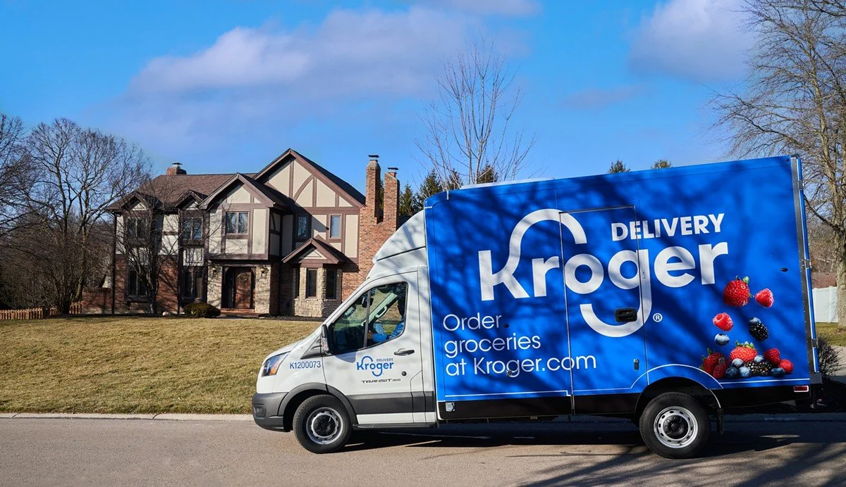 Kroger delivery van parked outside suburban house