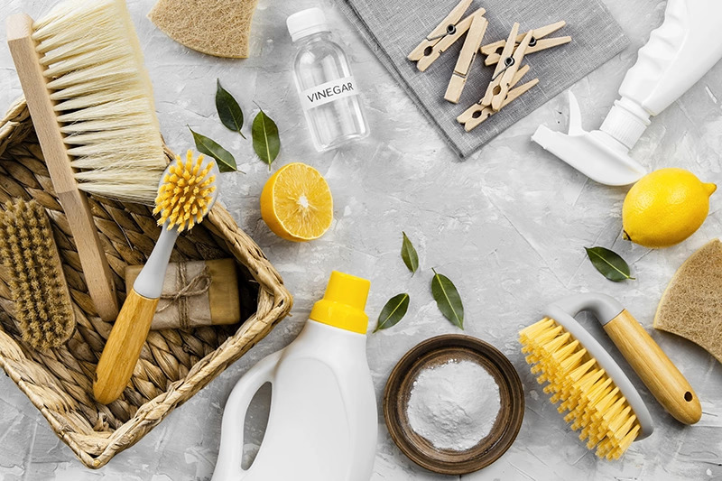 Eco-friendly cleaning supplies with lemon and vinegar