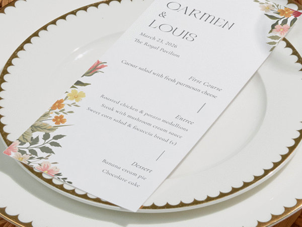 Wedding menu card on white scalloped plates