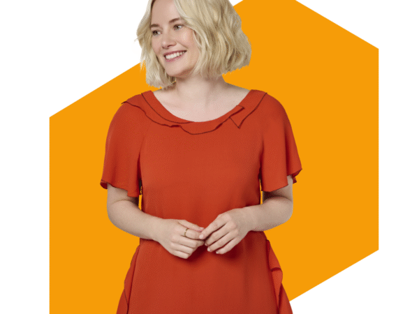 Smiling woman in orange dress with blonde hair
