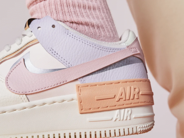 Close-up of pastel Nike Air sneaker with pink sock
