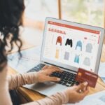 Woman shopping online with credit card