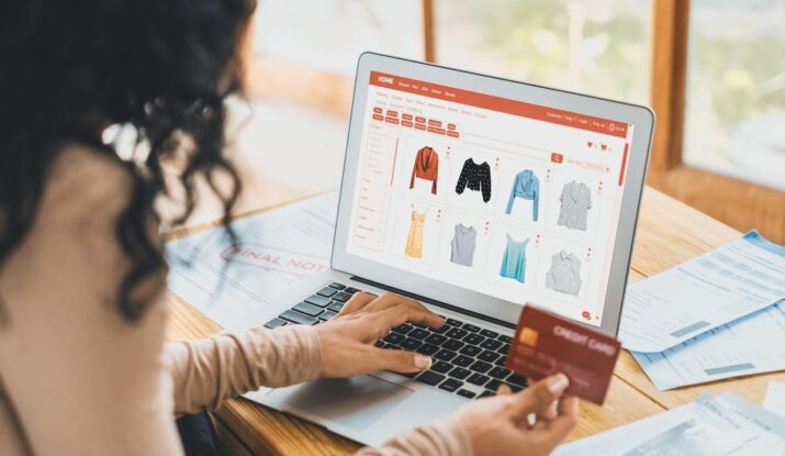 Woman shopping online with credit card